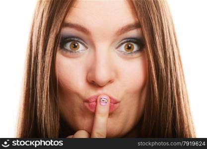 Love valentines day concept. Funny girl covers her mouth with hand showing pink emotional heart nails design on white
