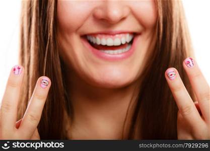 Love valentines day concept. Funny girl showing fingers with pink emotional heart nails design on white
