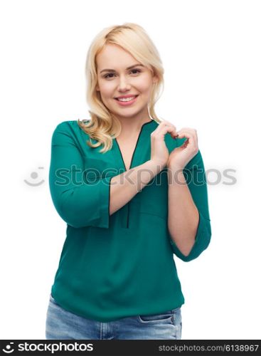 love, valentines day, gesture, plus size and people concept - smiling young woman in shirt and jeans showing heart shape hand sign