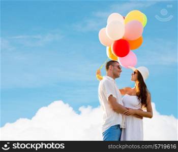 love, wedding, summer, dating and people concept - smiling couple wearing sunglasses with balloons hugging over blue sky and cloud background