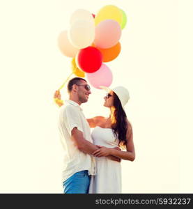 love, wedding, summer, dating and people concept - smiling couple wearing sunglasses with balloons hugging outdoors