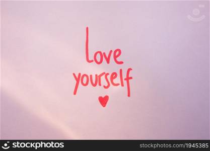 love yourself inscription purple table. High resolution photo. love yourself inscription purple table. High quality photo