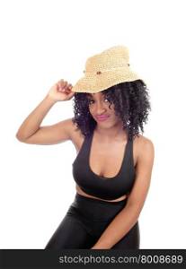 Lovely African American woman in black sports wear with a beige strawhat, looking into the camera, isolated for white background.