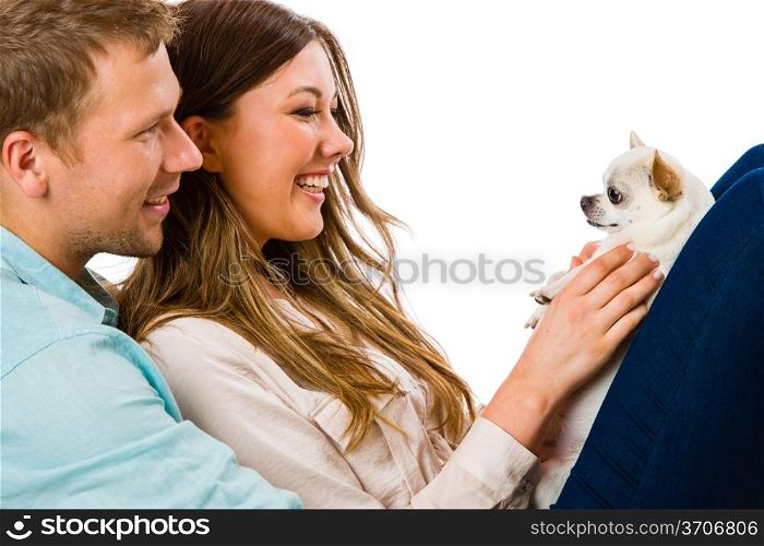 Lovely attractive couple and dog together, studio shot, white background