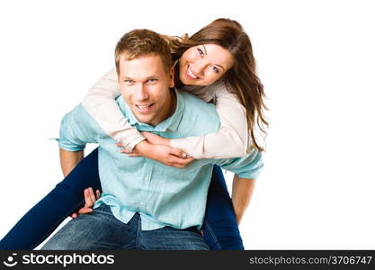 Lovely attractive couple on piggyback, studio shot, white background