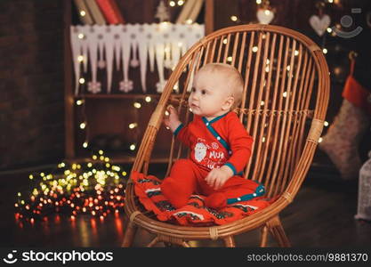 Lovely Baby boy in Santa Claus costume for Christmas.