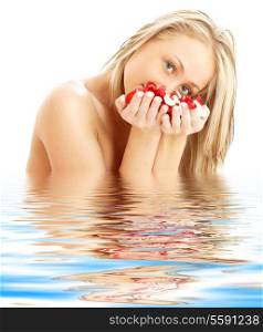 lovely blond with red and white rose petals in water