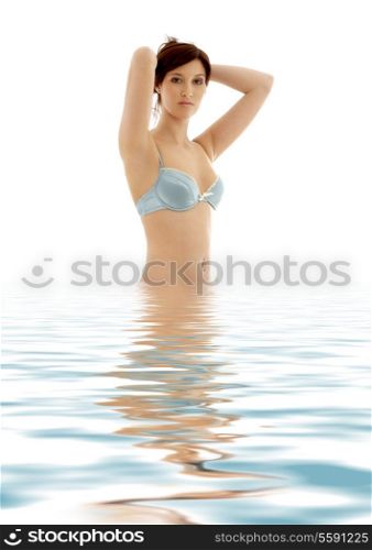 lovely brunette in blue lingerie standing in water
