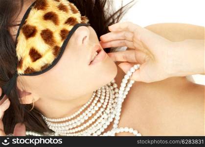 lovely brunette with pearls in leopard mask