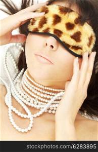 lovely brunette with pearls in leopard mask