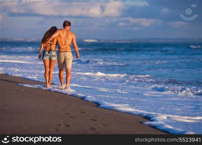 lovely couple walking on beach.Bali.Indonesia.
