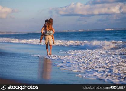 lovely couple walking on beach.Bali.Indonesia.