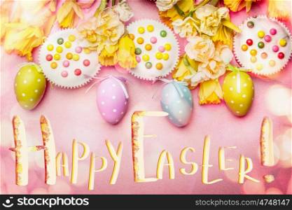 Lovely Easter setting in pastel color with decoration eggs, flowers,cakes and bokeh lighting on pink pale background, top view, border