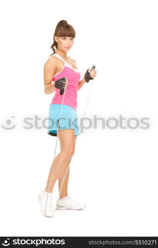 lovely fitness instructor with jump rope over white