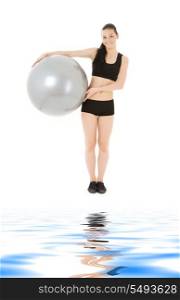 lovely fitness instructor with pilates ball