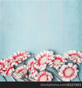 Lovely flowers on light blue shabby chic background, floral border, top view, quadrate. Creative layout for holidays greeting of Mothers day, birthday, wedding or happy event