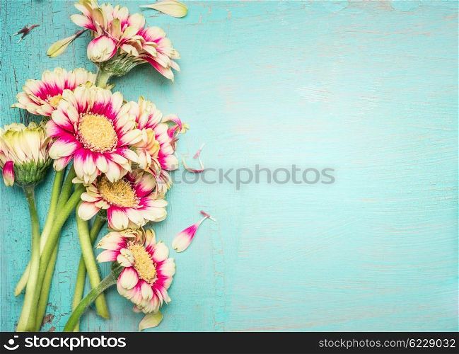 Lovely flowers on turquoise shabby chic background. Festive greeting card