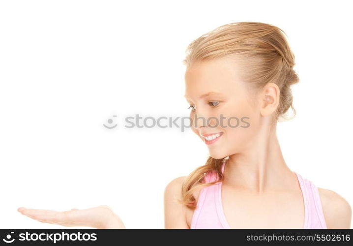 lovely girl holding something on the palm of her hand