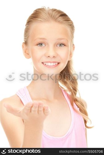lovely girl holding something on the palm of her hand
