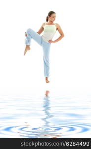 lovely girl practicing ashtanga yoga on white sand