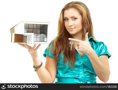 lovely girl with small house in hand and key on finger