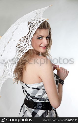 Lovely girl with umbrella isolated on a white background