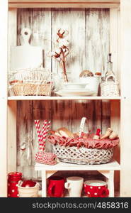 Lovely homeware and dishware in the kitchen at shabby chic style. Shelves in the rack