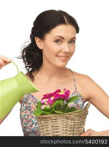 lovely housewife with flower in basket and watering can
