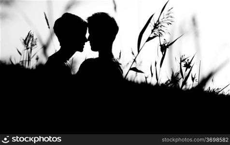 Lovely lesbian couple together on outdoor, silhouette, black and white image