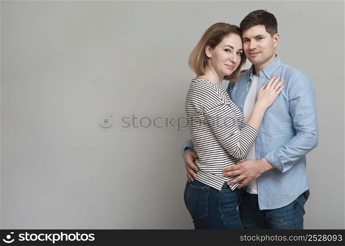 lovely man woman holding each other while posing