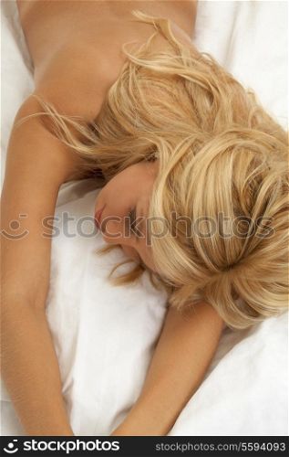 lovely naked blond dreaming in bed
