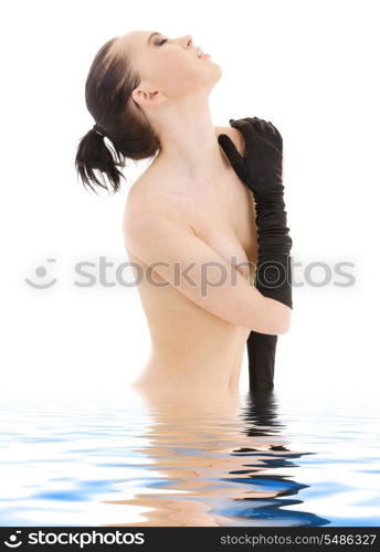 lovely naked woman in black gloves over white