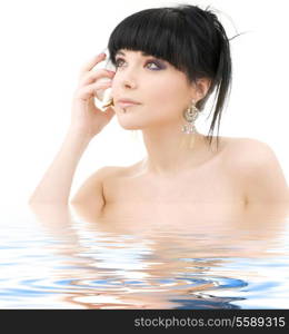 lovely oriental girl with shell in water