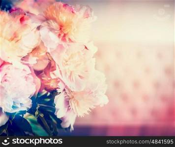 Lovely peonies bunch with sunny bokeh lighting, pink pastel color, close up