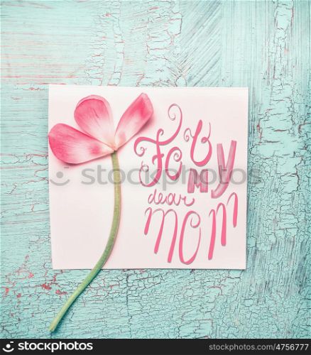 Lovely pink flowers for my dear mom on turquoise shabby chic background, top view. Mother&rsquo;s Day concept