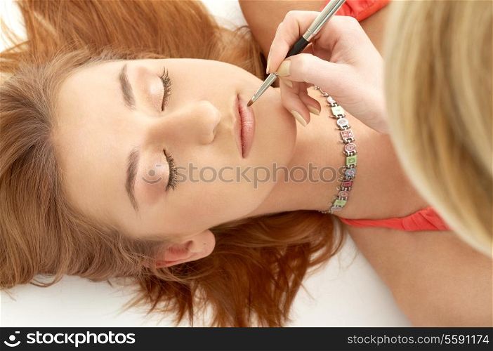 lovely redhead laying at professional makeup studio