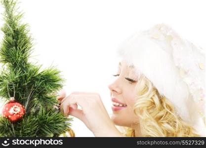 lovely santa helper girl decorating christmas tree