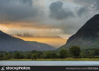 Lovely sunrise landscape image looking along Loweswater towards wonderful light on Grasmoor and Mellbreak mountains in Lkae District