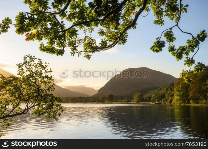 Lovely sunrise landscape image looking along Loweswater towards wonderful light on Grasmoor and Mellbreak mountains in Lkae District