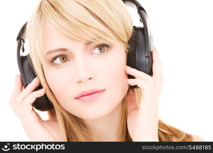 lovely teenage girl in headphones over white