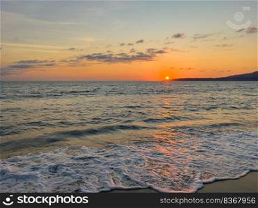 Lovely warm sunset over the Pacific Ocean in Mexico for a tropical background of nature 