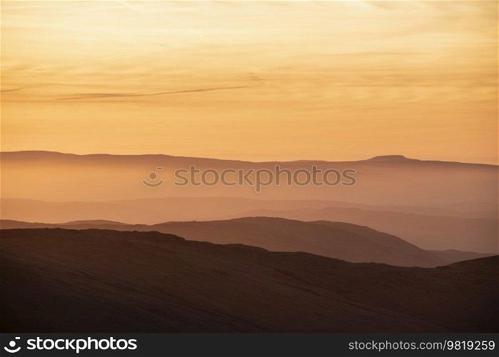 Lovely Winter landscape view from Red Screeds across misty layers of mountains Ill Bell, Stony Cove Pike and Tarn Crag