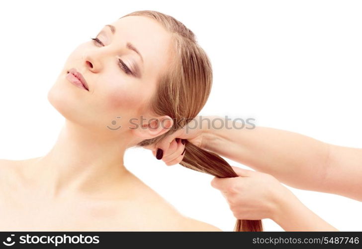 lovely woman face and female hands pulling her hair