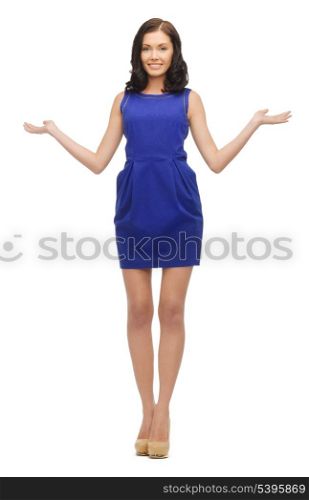 lovely woman in dress showing something on the palms of her hands