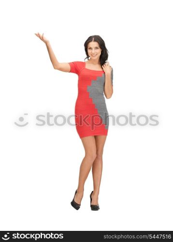 lovely woman in elegant dress showing direction