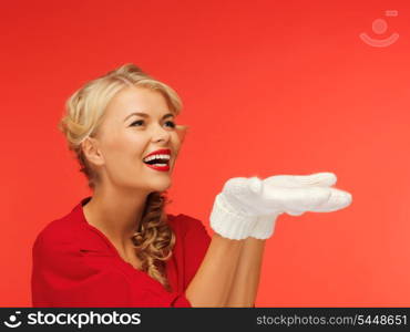 lovely woman in red dress and white mittens holding something on the palms