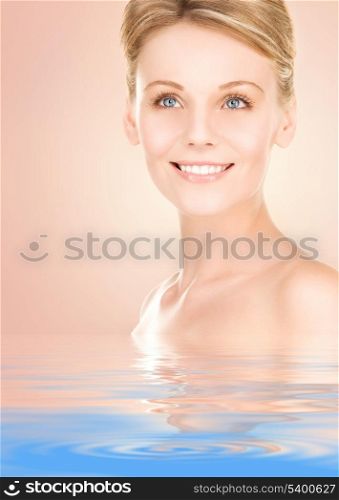 lovely woman in water over beige background