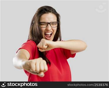 Lovely woman pretending that she&rsquo;s fighting