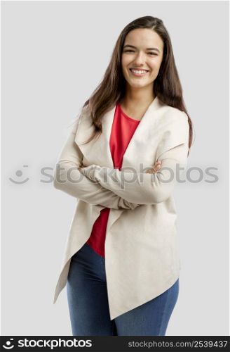Lovely woman smiling at the camera with her arms folded