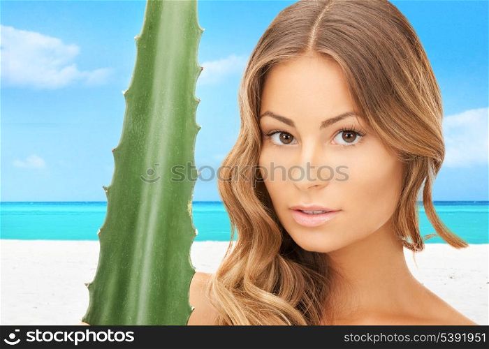 lovely woman with aloe vera over tropical beach background